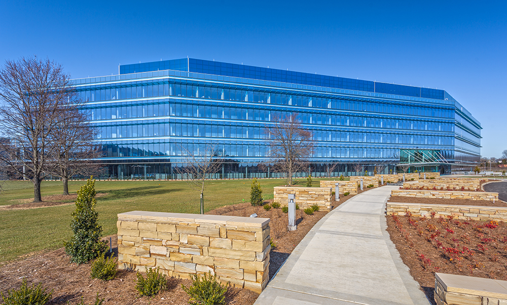 Eastman Uses Multi-layered Entrance Strategy at New Corporate Business Center  Logo